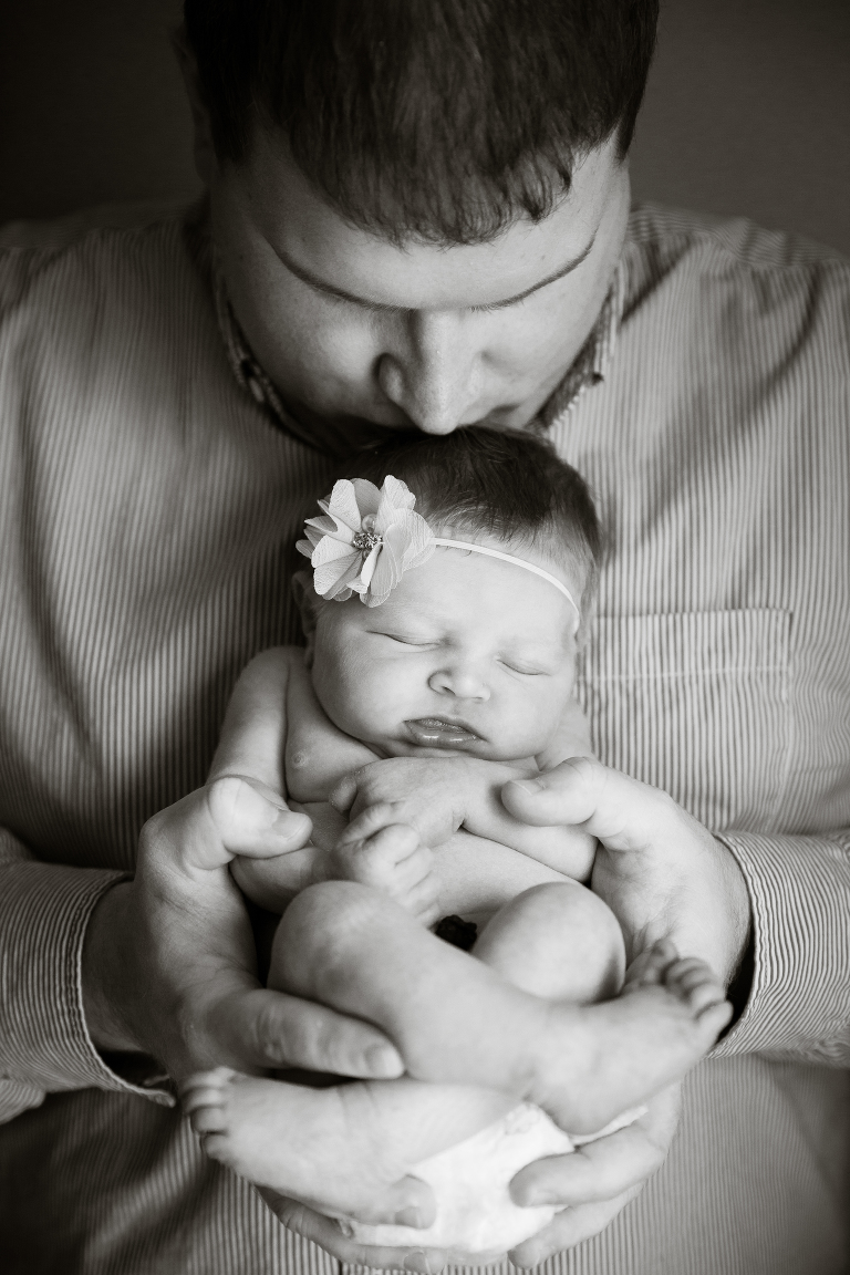 Dad holding daughter