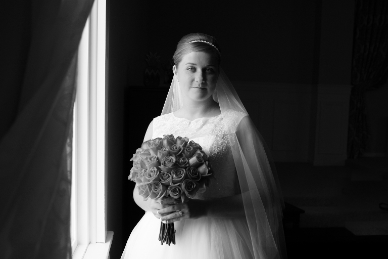 Bride next to window