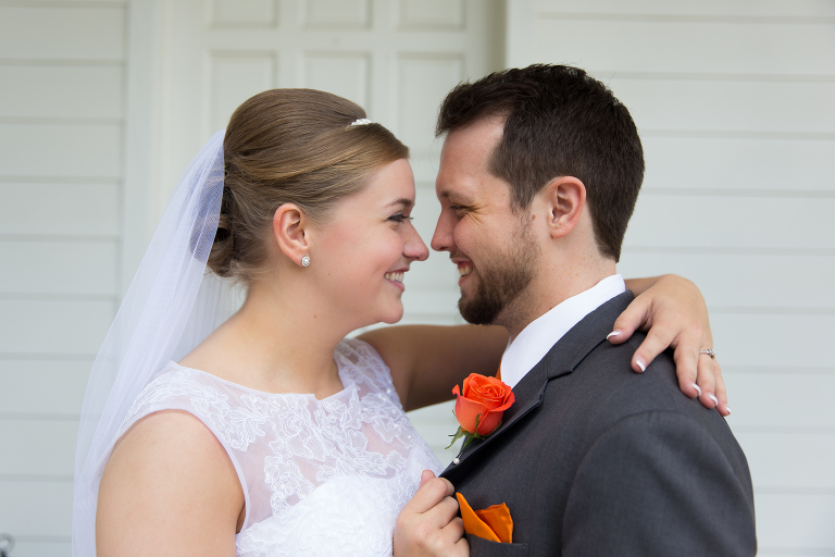 Bride and Groom with orange corsage