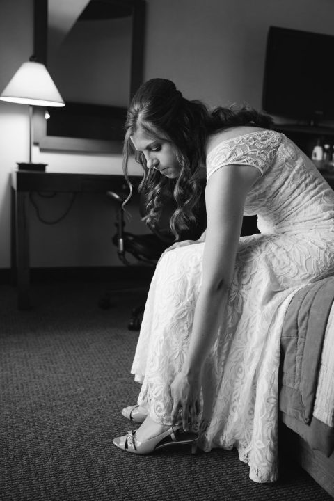 bride putting on her shoe