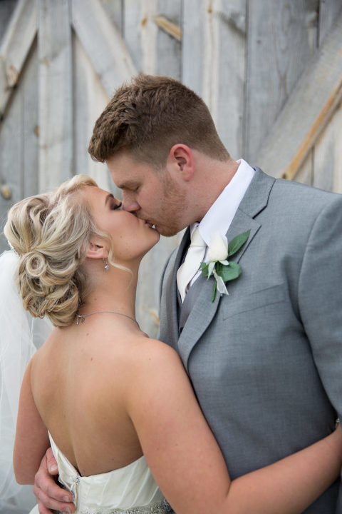 Kissing Bride and groom at Stonehill Barn