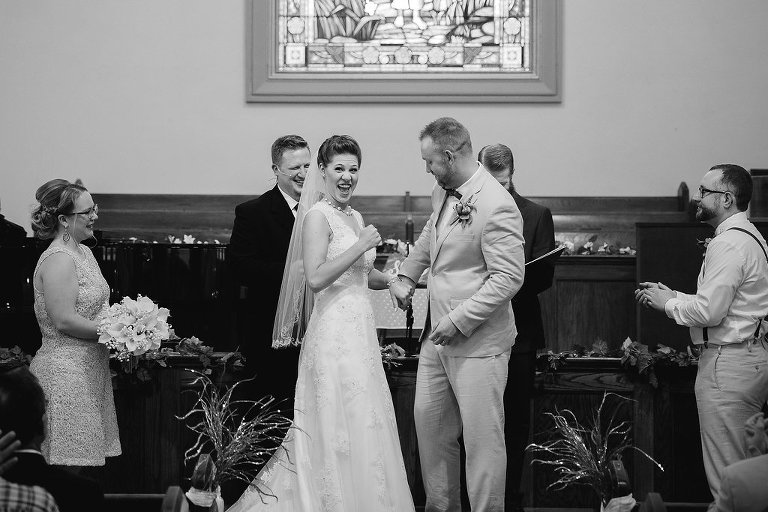 bride giving thumbs up at wedding