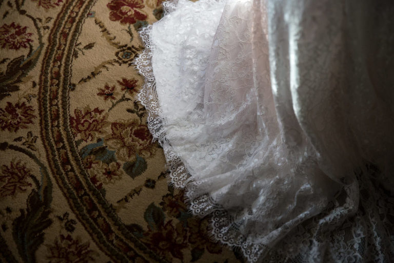 wedding dress on rug