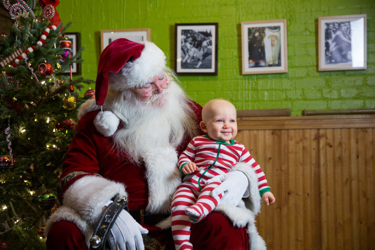 Smiling kid with Santa at Public