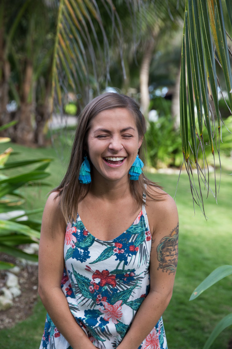 girl laughing on the beach