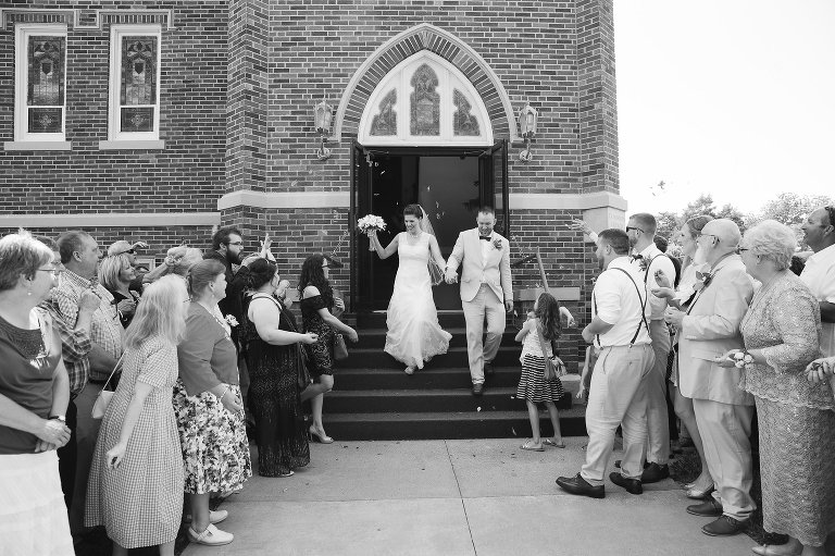 bride and groom exiting church in Lindsborg kansas
