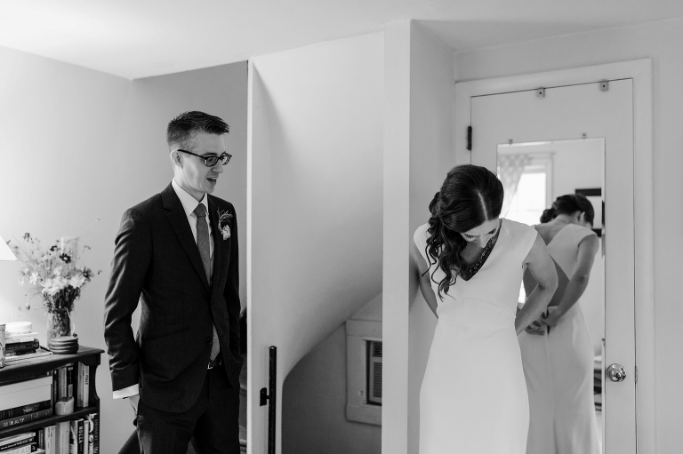 bride and groom getting dressed for wedding
