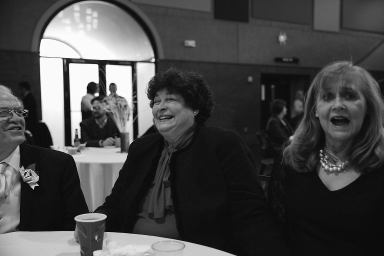 woman laughing at wedding reception