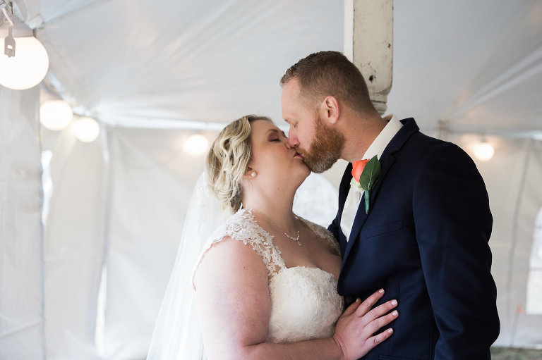 bride and groom kissing at emma creek barn